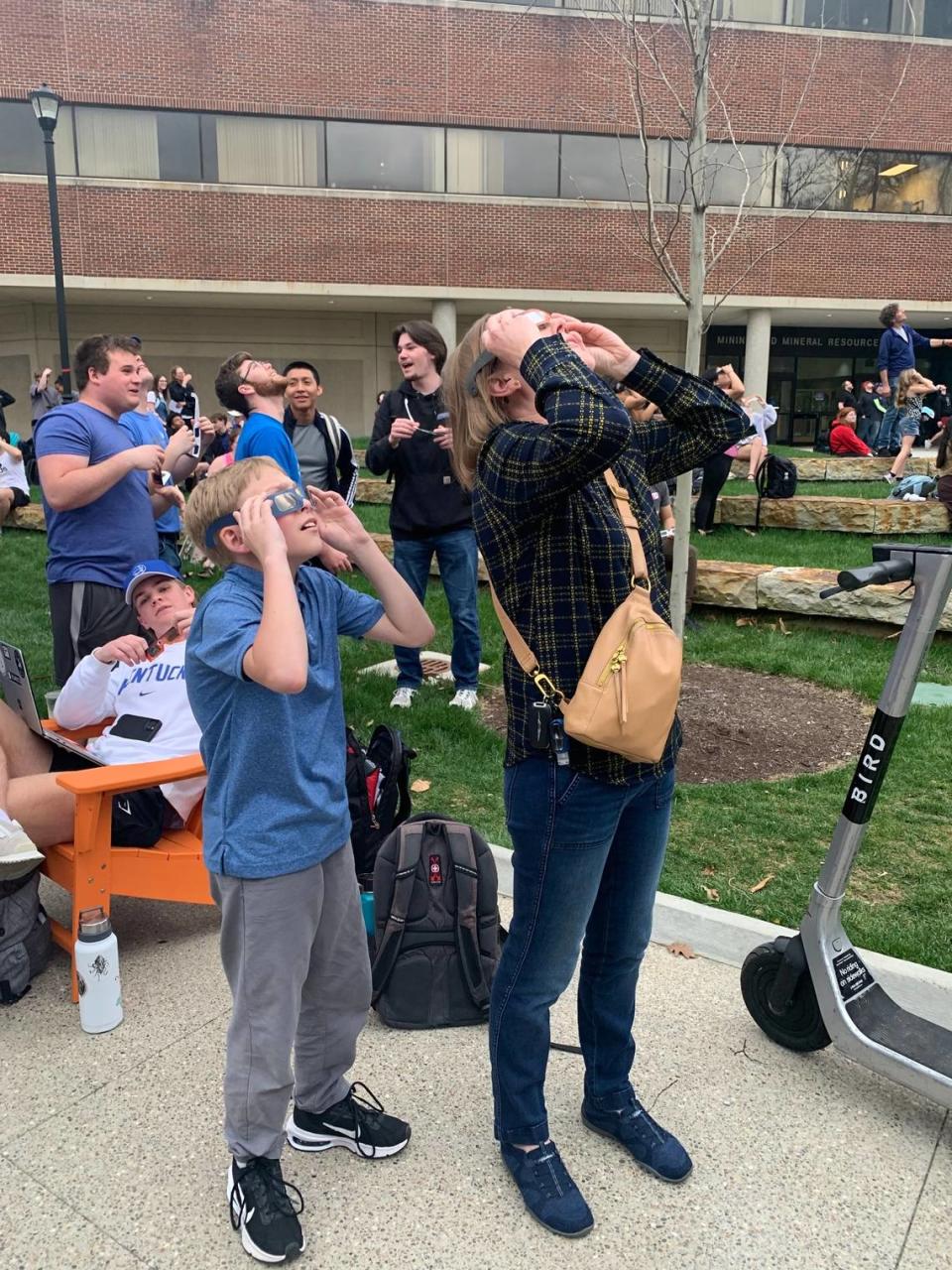 Donna Lee and her son watch the eclipse April 8, 2024. Kendall Staton