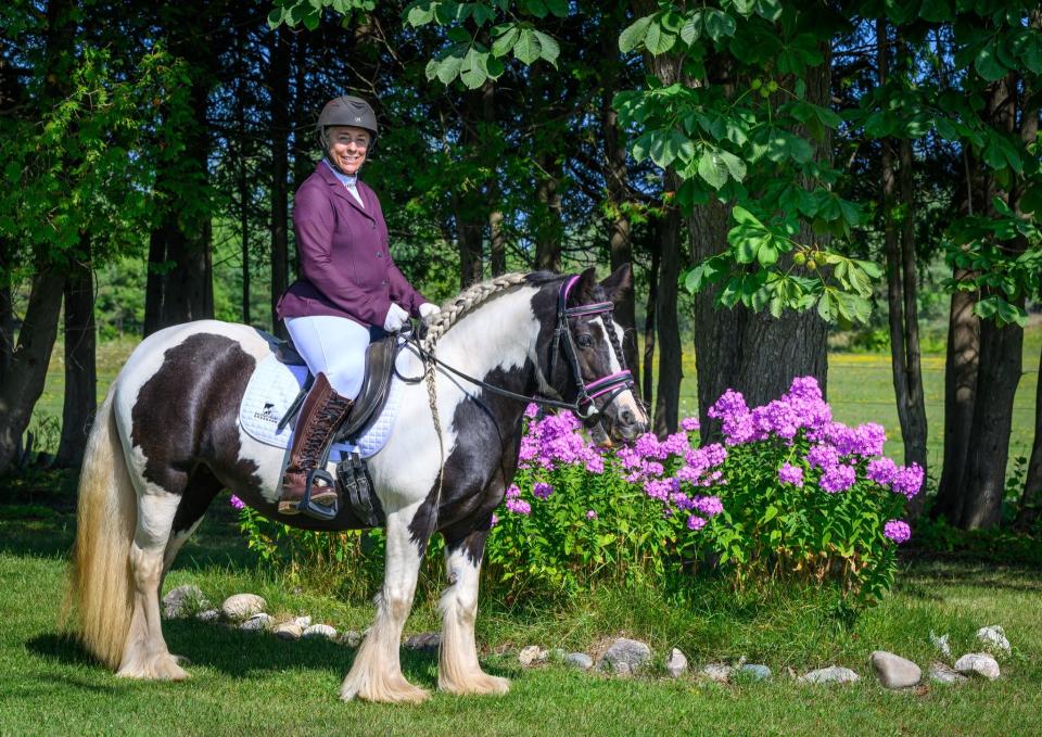 Kathy Johnson and Bella dressed and braided for classic dressage.