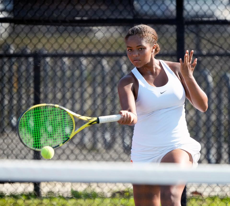 Spruce Creek's Giselle Adekunle hits a forehand during Region 1-4A finals at Spruce Creek High School in Port Orange, Thursday, April 25, 2024.