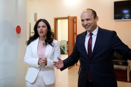 Israeli Education Minister Naftali Bennett (R) and Justice Minister Ayelet Shaked, from the Jewish Home party, enter the room before delivering their statements in Tel Aviv, Israel December 29, 2018. REUTERS/Corinna Kern