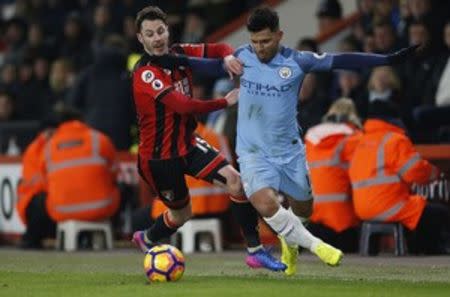 Britain Football Soccer - AFC Bournemouth v Manchester City - Premier League - Vitality Stadium - 13/2/17 Manchester City's Sergio Aguero in action with Bournemouth's Adam Smith Action Images via Reuters / Matthew Childs Livepic