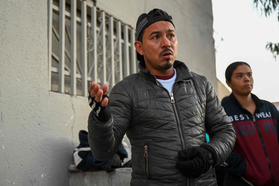 Vladimir Castellanos, a migrant from Venezuela, speaks during an interview about the impact of Title 42 immigration policy while they wait across from El Paso, Texas at a shelter in Mexico near the US-Mexico border in Ciudad Juarez, Chihuahua state, Mexico on December 19, 2022.