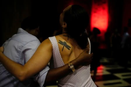 People dance tango in a hotel in Havana