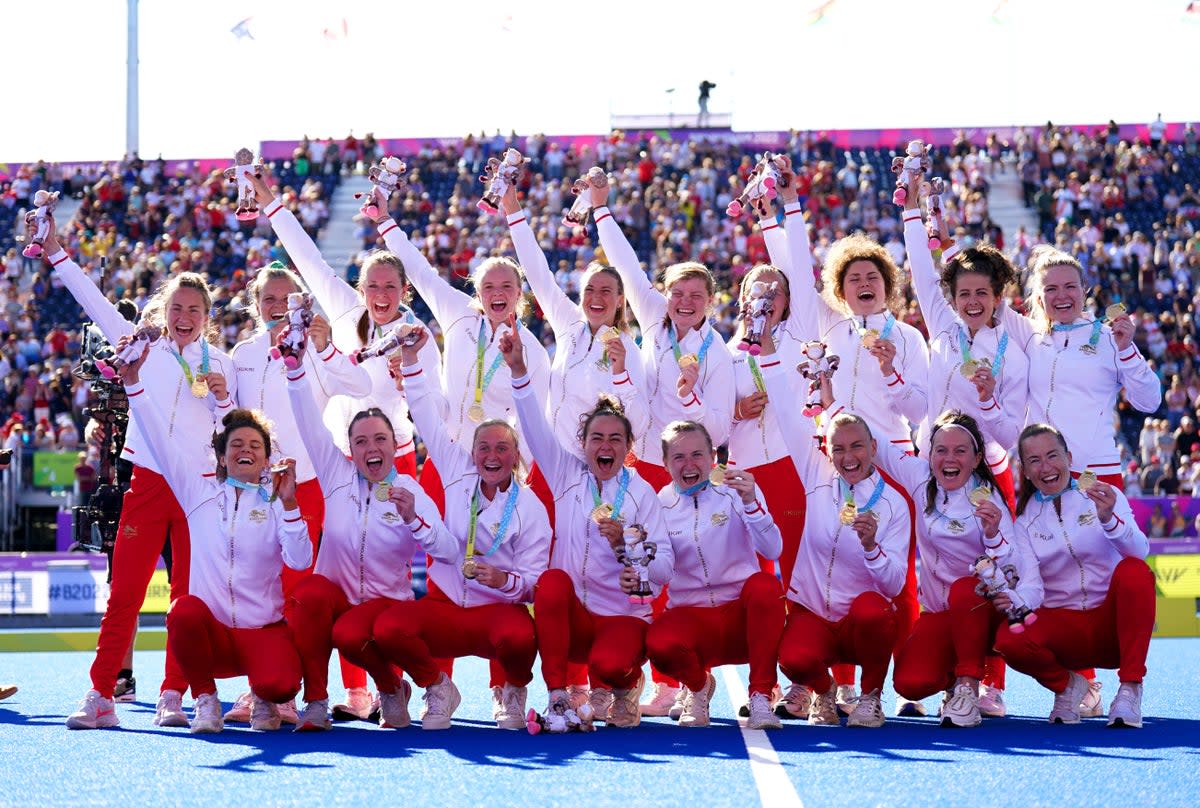 The England team celebrate with their gold medals after winning the women’s hockey final against Australia (Joe Giddens/PA) (PA Wire)