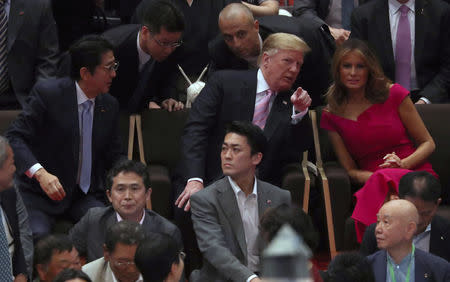 U.S. President Donald Trump, first lady Melania Trump and Japanese Prime Minister Shinzo Abe watch the Summer Grand Sumo Tournament at Ryogoku Kokigikan Sumo Hall in Tokyo, Japan May 26, 2019. REUTERS/Jonathan Ernst