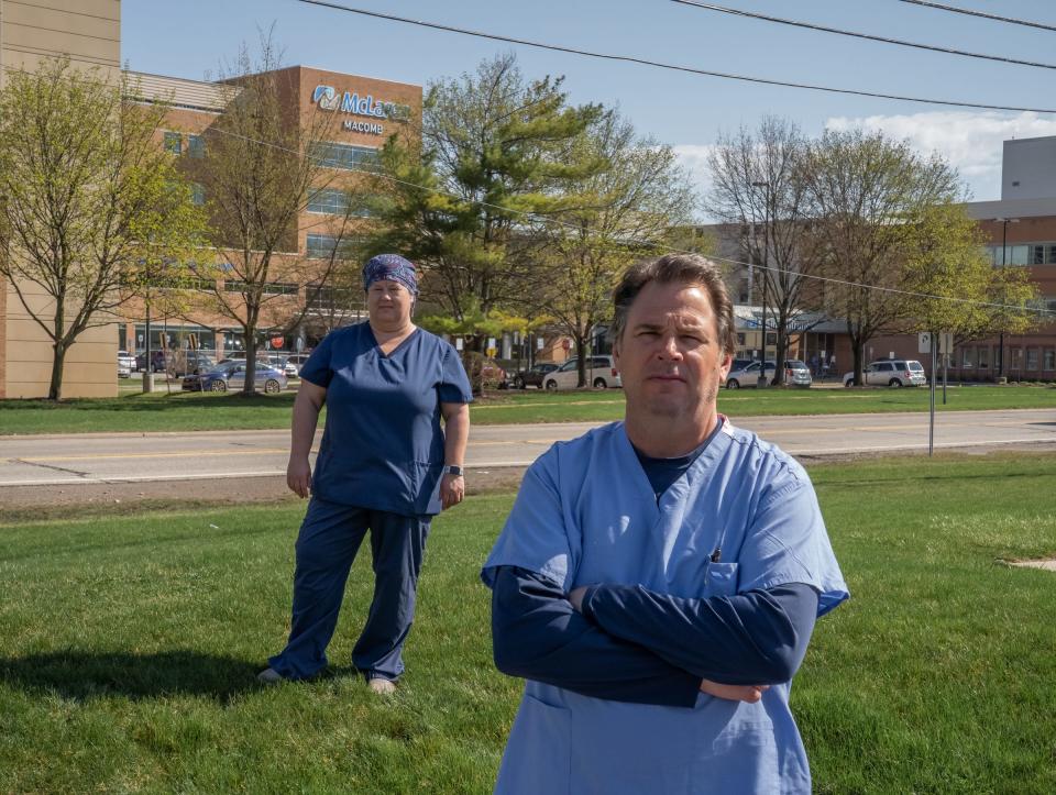 McLaren Macomb nurses Jeff Morawski (right) and Terri Dagg-Barr stand outside of McLaren Macomb Hospital in Mt. Clemens on Friday, April 9, 2021. Morawski and Dagg-Barr, both leaders with OPEIU Local 40, are some of the countless health care workers feeling overwhelmed. 