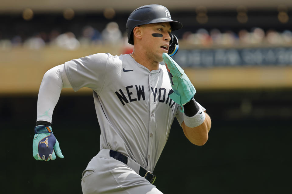 New York Yankees' Aaron Judge scores from second base on a double by Gleyber Torres during the first inning of a baseball game against the Minnesota Twins, Thursday, May 16, 2024, in Minneapolis. (AP Photo/Bruce Kluckhohn)