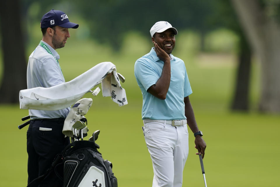 Wyatt Worthington II stands in the fairway on the second hole during a practice round for the PGA Championship golf tournament, Tuesday, May 17, 2022, in Tulsa, Okla. (AP Photo/Eric Gay)