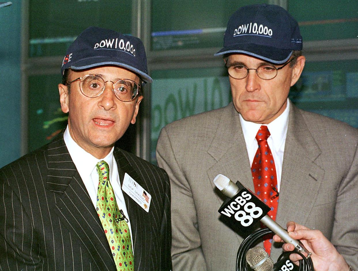 New York Stock Exchange Chairman Richard Grasso (L) and New York City Mayor Rudy Giuliani (R) wear 