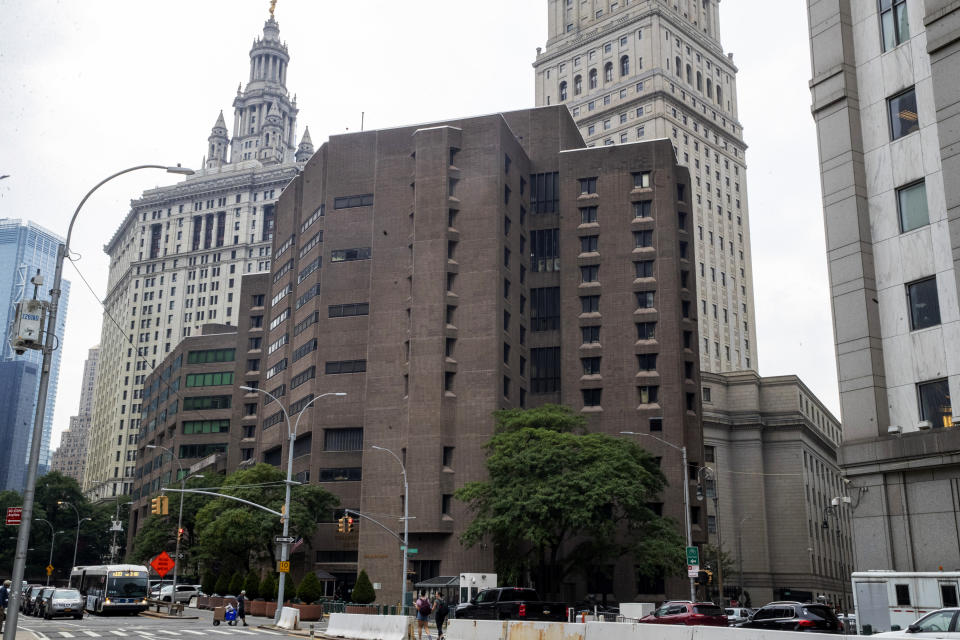 FILE - This Aug. 13, 2019, file photo, shows the Metropolitan Correctional Center in New York. Two correctional officers responsible for guarding Jeffrey Epstein the night he killed himself at the Metropolitan Correctional Center have been charged with falsifying prison records. A grand jury indictment made public Tuesday, Nov. 19 accused guards Toval Noel and Michael Thomas of failing to perform checks on Epstein every half hour, as required, and of fabricating log entries to show they had. Epstein was found dead in his cell in August at the correctional center, where he had been awaiting trial on sex trafficking charges. (AP Photo/Mary Altaffer, File)