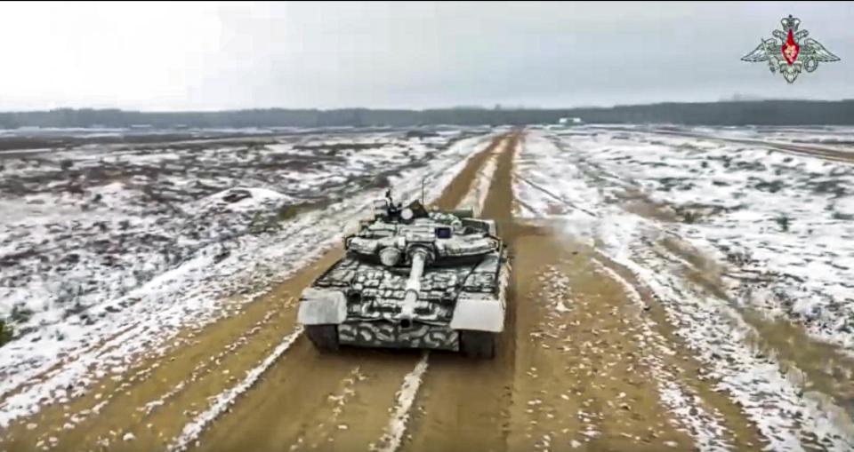 FILE - In this handout photo taken from video released by Russian Defense Ministry Press Service on Monday, Dec. 19, 2022, Russian troops take part in drills at an unspecified location in Belarus. Belarus President Alexander Lukashenko has welcomed thousands of Russian troops to his country, allowed the Kremlin to use it to launch the invasion of Ukraine on Feb. 24, 2022, and offered to station some of Moscow’s tactical nuclear weapons there. But he has avoided having Belarus take part directly in the fighting – for now. (Russian Defense Ministry Press Service via AP, File)