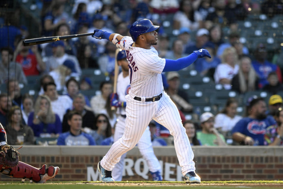 Chicago Cubs' Willson Contreras watches his two-run home run during the first inning of the team's baseball game against the St. Louis Cardinals on Thursday, June 2, 2022, in Chicago. (AP Photo/Paul Beaty)