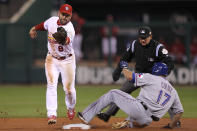 ST LOUIS, MO - OCTOBER 27: Nelson Cruz #17 of the Texas Rangers is safe at second base ahead of Nick Punto #8 of the St. Louis Cardinals after an error by Matt Holliday #7 in the fourth inning during Game Six of the MLB World Series at Busch Stadium on October 27, 2011 in St Louis, Missouri. (Photo by Ezra Shaw/Getty Images)