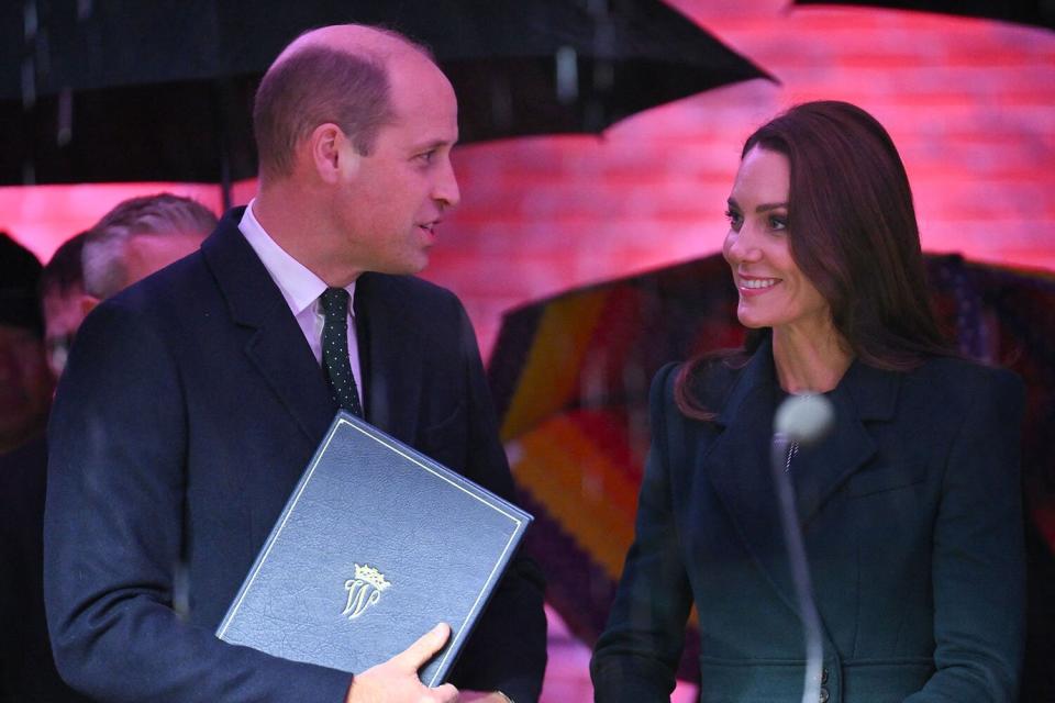 BOSTON, MASSACHUSETTS - NOVEMBER 30: Prince William, Prince of Wales, and Catherine, Princess of Wales pose with Mayor Michelle Wu (R) as they kick off Earthshot celebrations by lighting up Boston at Speaker’s Corner by City Hall on November 30, 2022 in Boston, Massachusetts. The Prince and Princess of Wales are visiting the coastal city of Boston to attend the second annual Earthshot Prize Awards Ceremony, an event which celebrates those whose work is helping to repair the planet. During their trip, which will last for three days, the royal couple will learn about the environmental challenges Boston faces as well as meeting those who are combating the effects of climate change in the area. (Photo by Chris Jackson/Getty Images)