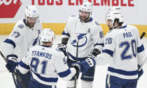 Tampa Bay Lightning's Nikita Kucherov (86) celebrates with teammates after scoring against the Montreal Canadiens during second-period NHL hockey game action in Montreal, Thursday, April 4, 2024. (Graham Hughes/The Canadian Press via AP)