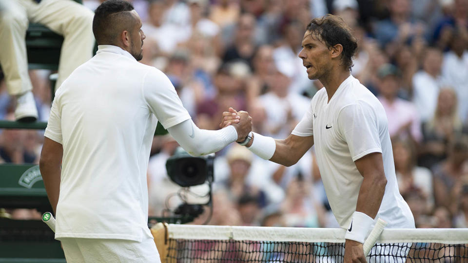 Rafael Nadal and Nick Kyrgios shake hands after their match at Wimbledon. (Photo by Visionhaus/Getty Images)