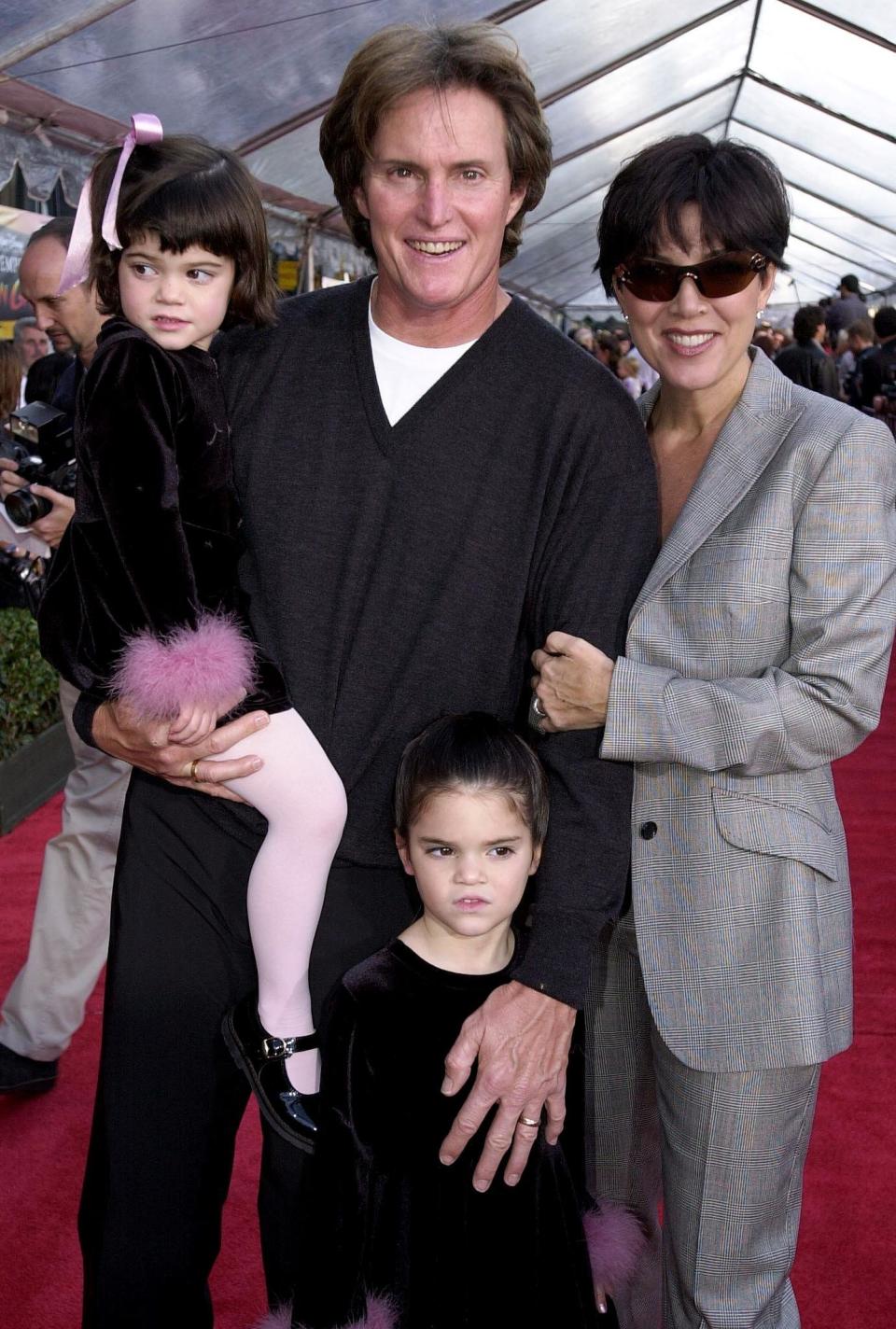 HOLLYWOOD, :  Former US gold medal decathlete Bruce Jenner (C), his wife Kris (R) and children Kylie (L) and Kendall (BELOW) appear at the, 10 December 2000, premiere of Walt Disney's 'The Emperor's New Groove' at the El Capitan Theater in Hollywood, CA. The film opens in the US on 15 December 2000 AFP Photo/Scott NELSON (Photo credit should read Scott Nelson/AFP/Getty Images)