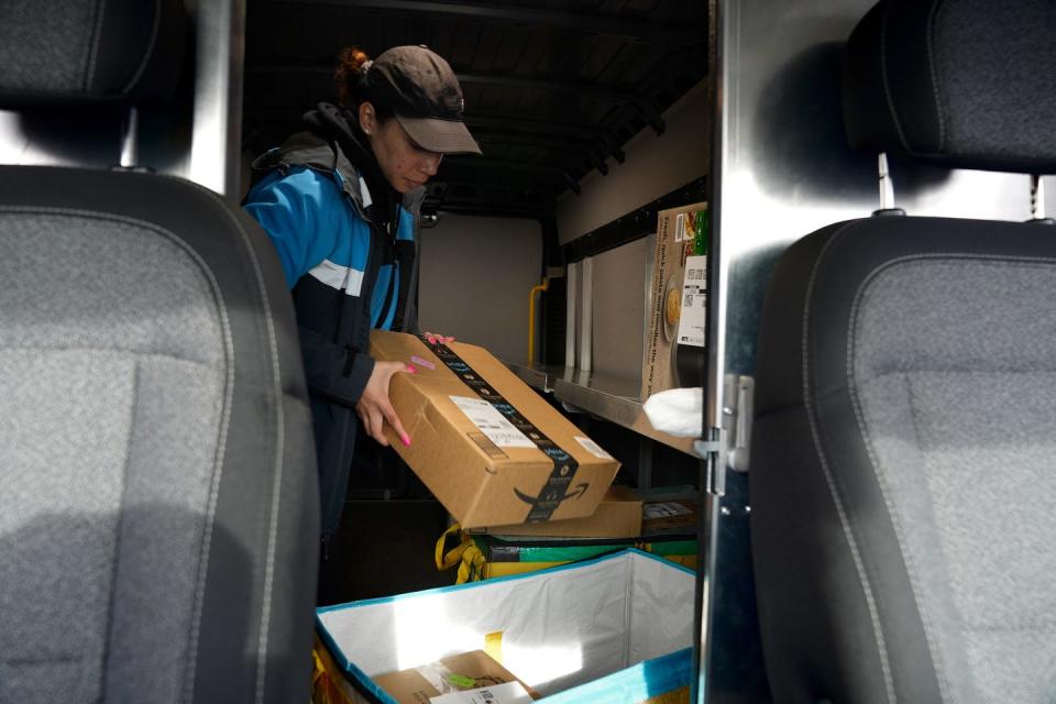 Rivera checks the packages in the rear of her Amazon delivery truck before starting her deliveries.