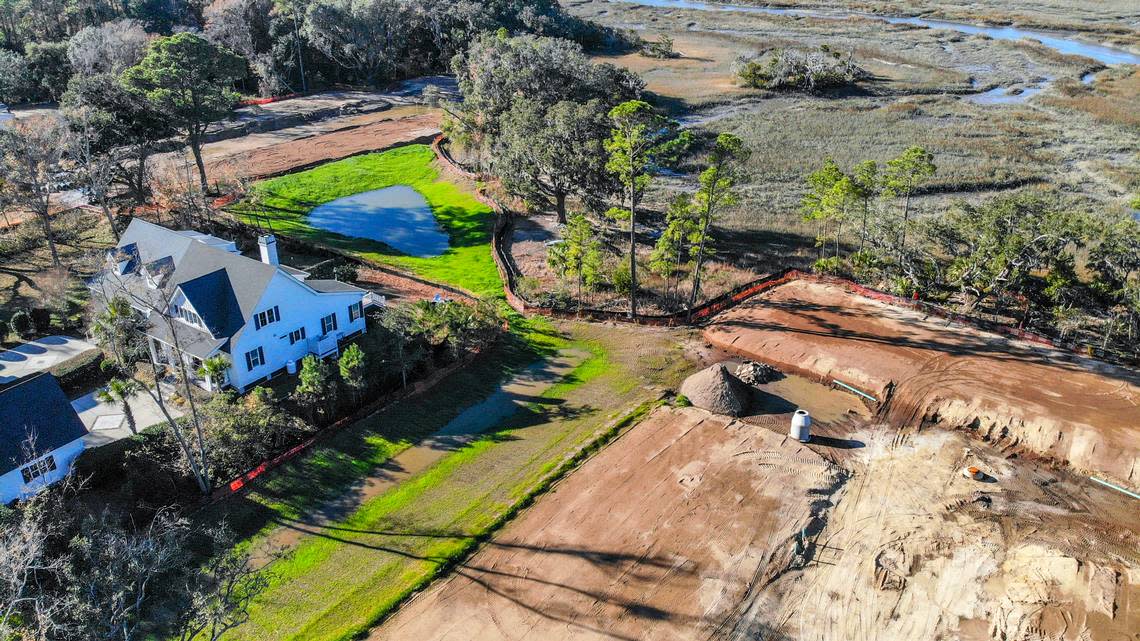 This home along the marshes of Jarvis Creek along Jonesville Road, with clear cut land on both sides as seen on Friday, Jan. 6, 2023, will be sandwiched between a new housing development currently under construction on Hilton Head Island.