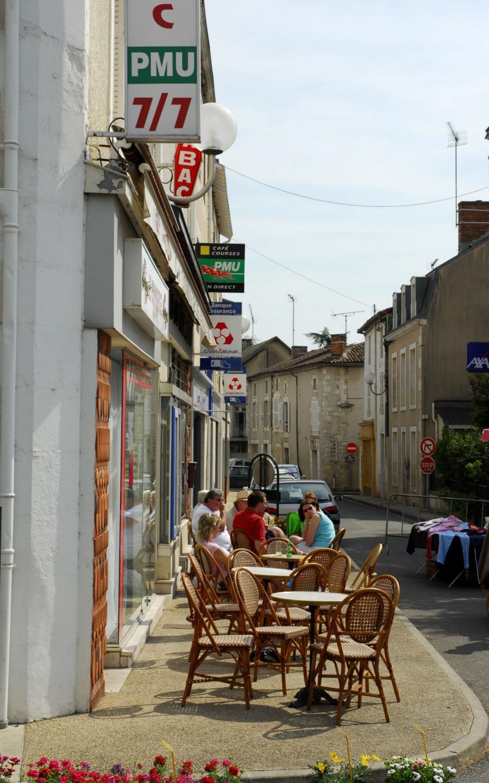 Street cafe scene in Civray, France - Credit: Brough Tomlinson/Alamy