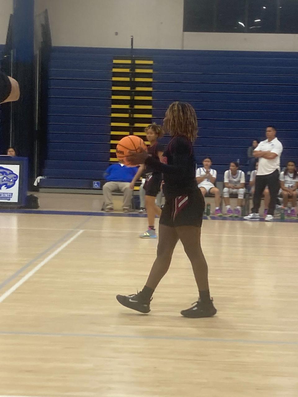 Palm Beach Central girls basketball player Triniti Crouse dribbles against Wellington on Wednesday, Dec. 6, 2023.