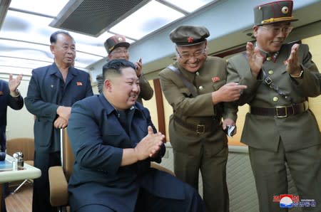 KCNA picture of North Korean leader Kim Jong Un guiding the test firing of a new weapon