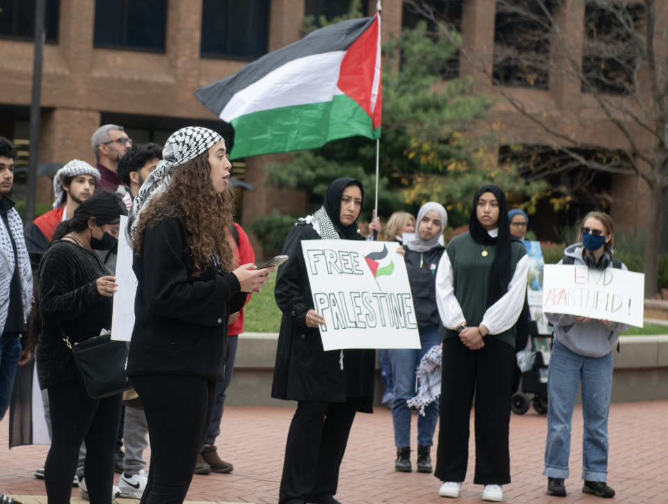 Carmen Barghouty speaks to the crowd about Palestine during a rally Thursday on the Kent State University campus.