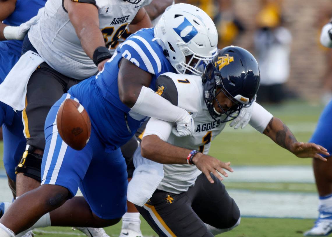 Duke Blue Devils defensive tackle Aeneas Peebles tackles North Carolina A&T Aggies quarterback Jalen Fowler, causing him to fumble the ball, during the first half of Dukes game against North Carolina A&T at Wallace Wade Stadium in Durham, N.C. on Saturday, Sept. 17, 2022.