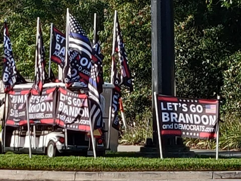 Flags for sale outside CPAC read, "Let's go Brandon" — a rallying cry from the right that actually means "F-ck Joe Biden."