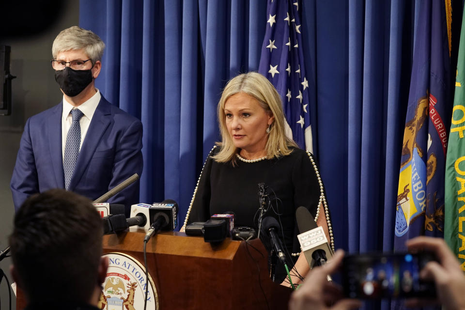 Oakland County prosecutor Karen McDonald addresses the media in her office, Friday, Dec. 3, 2021, in Pontiac, Mich. McDonald filed involuntary manslaughter charges against Jennifer and James Crumbley, the parents of 15-year-old Ethan Crumbley, who is accused of killing four students at a Michigan high school. McDonald says the gun used in the shootings at Oxford High School was purchased by James Crumbley a week ago and given to the boy. (AP Photo/Carlos Osorio)