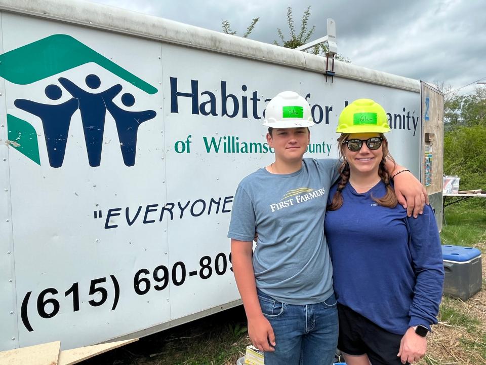 First Farmers Marketing Director Felicia Brown and son, Colby, 15, volunteer during the Habitat for Humanity build project.