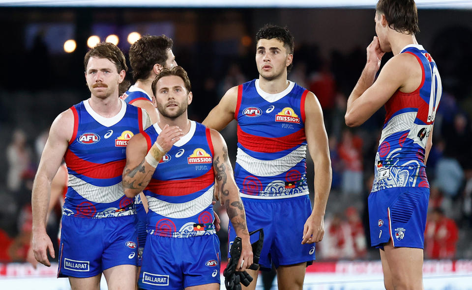 Western Bulldogs players, pictured here after their AFL loss to the Sydney Swans.