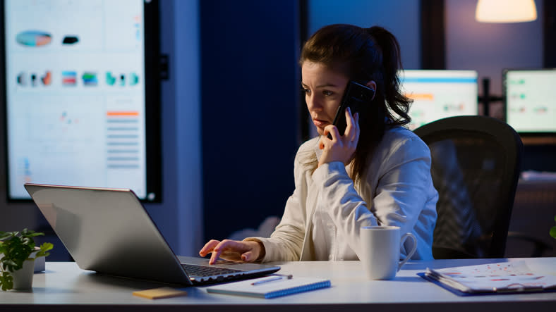 A woman looking up requirements for online certified financial planner (CFP) programs.