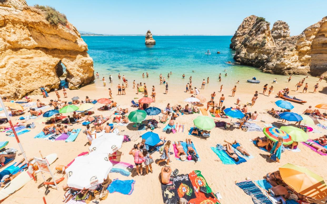 Tourists sunbathing in Praia do Camilo, Lagos, Faro district, Algarve, Portugal, before the Covid travel ban - Marco Bottigelli/Marco Bottigelli