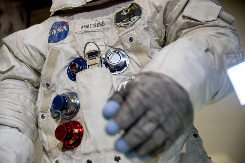 Neil Armstrong's Apollo 11 spacesuit is unveiled at the Smithsonian's National Air and Space Museum on the National Mall in Washington, Tuesday, July 16, 2019. (AP Photo/Andrew Harnik)