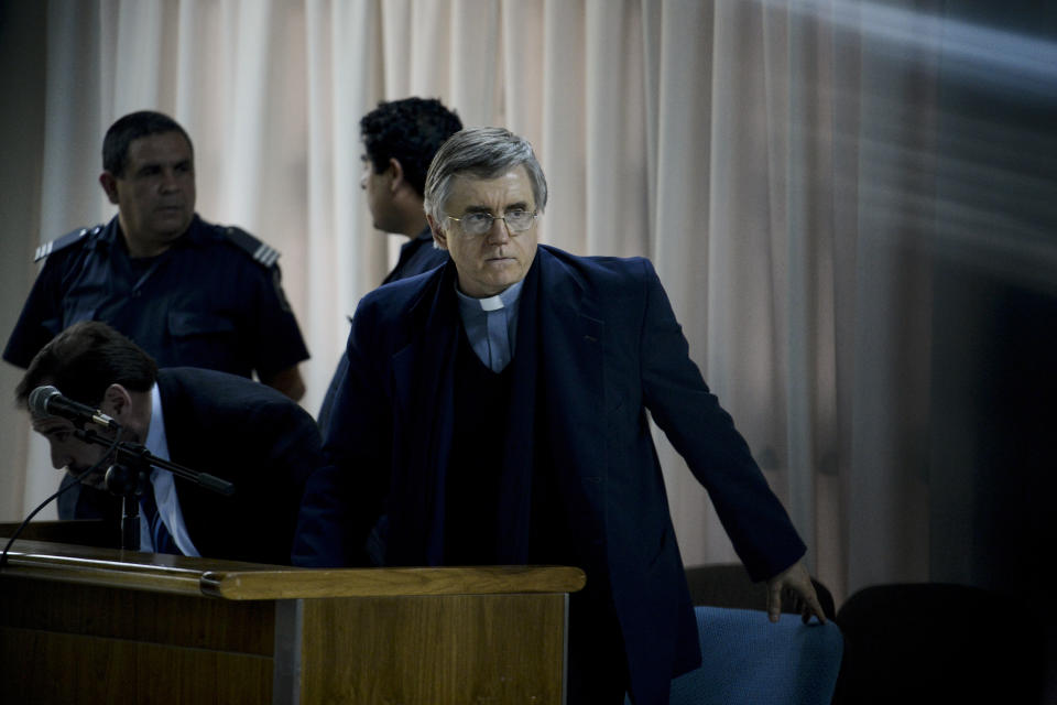 In this Sept. 9, 2013 photo, Rev. Julio Grassi stands in a courtroom, on the outskirts of Buenos Aires, Argentina. Argentina's Supreme Court in March 2017 upheld the conviction and 15-year prison sentence against Grassi, a celebrity priest who ran homes for street children across Argentina. (AP Photo/Sol Vazquez)