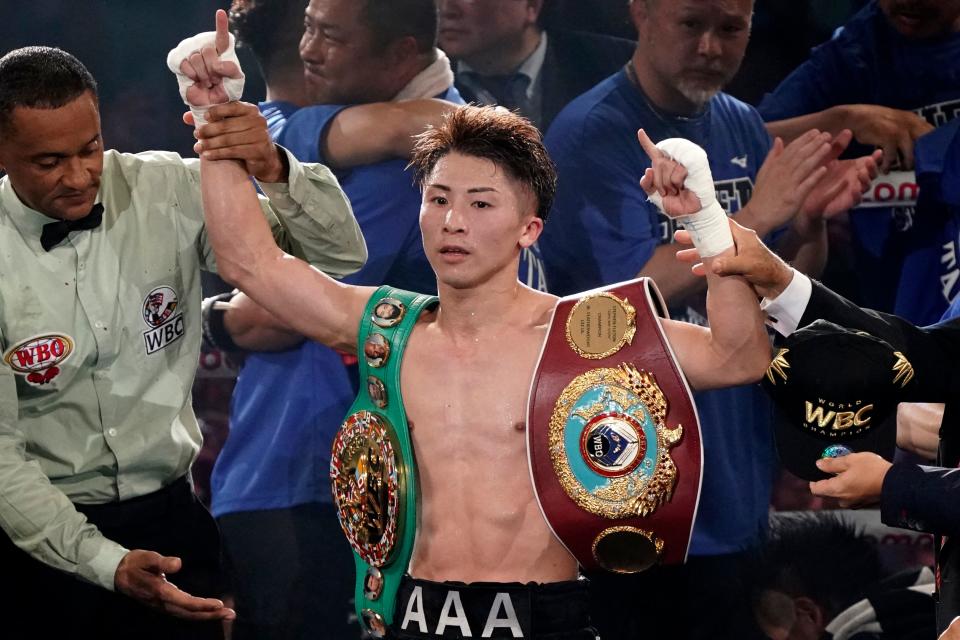 Naoya Inoue (C) of Japan celebrates his win over Stephen Fulton (not pictured) of the US in the WBC, WBO super bantamweight world title match at Ariake Arena in Tokyo on July 25, 2023. (Photo by Kazuhiro NOGI / AFP) (Photo by KAZUHIRO NOGI/AFP via Getty Images)