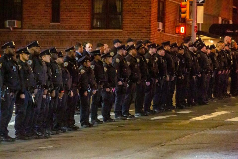 NYPD officers lined up to at the City Morgue office in honor of Diller. William Miller