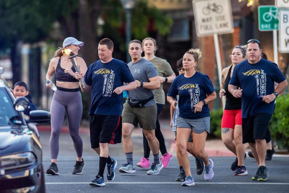 Participants in the Law Enforcement Torch Run for Special Olympics Northern California turn onto West Main Street in Merced, Calif., on Thursday, June 15, 2023. Andrew Kuhn/akuhn@mercedsun-star.com