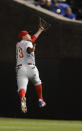 CHICAGO, IL - MAY 17: Freddy Galvis #13 of the Philadelphia Phillies makes a leaping catch against the Chicago Cubs in the ninth inning on May 17, 2012 at Wrigley Field in Chicago, Illinois. The Philadelphia Phillies defeated the Chicago Cubs 8-7. (Photo by David Banks/Getty Images)