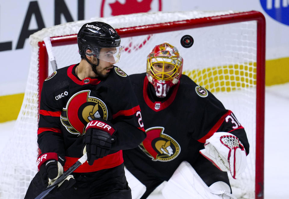 Ottawa Senators defenseman Artem Zub (2) and goaltender Anton Forsberg (31) keep their eyes on the puck during the second period of an NHL hockey game against the Chicago Blackhawks on Thursday, March 28, 2024, in Ottawa, Ontario. (Sean Kilpatrick/The Canadian Press via AP)