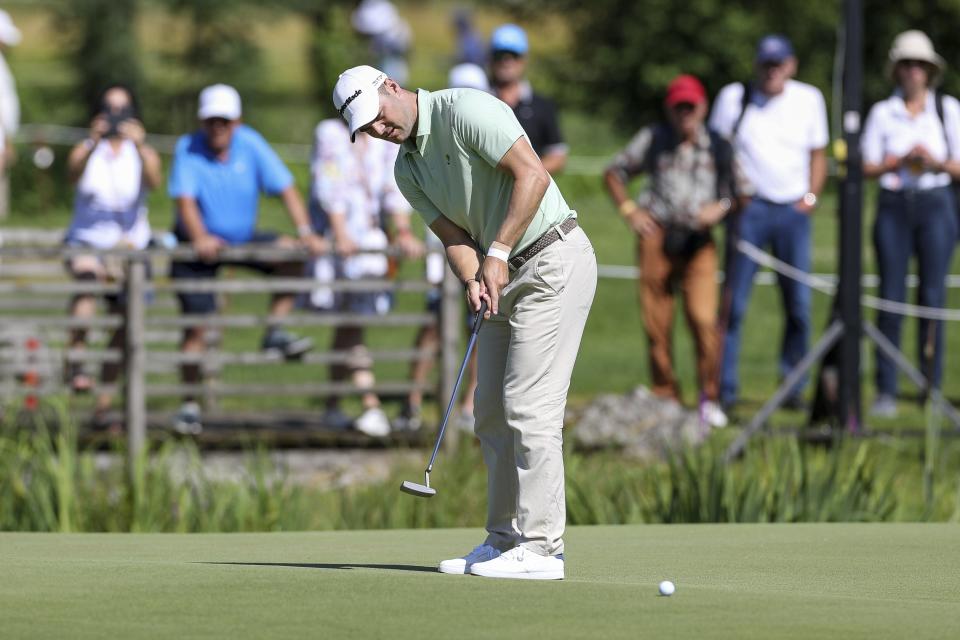 Germany's Martin Kaymer putts during the German International Open golf tournament at Golfclub Muenchen Eichenried in Munich, Germany, Thursday, June 23, 2022. (Christian Kolbert/dpa via AP)