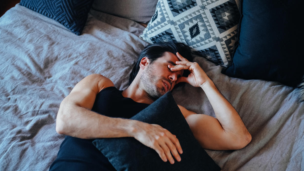 Man resting in his bedroom is feeling lost