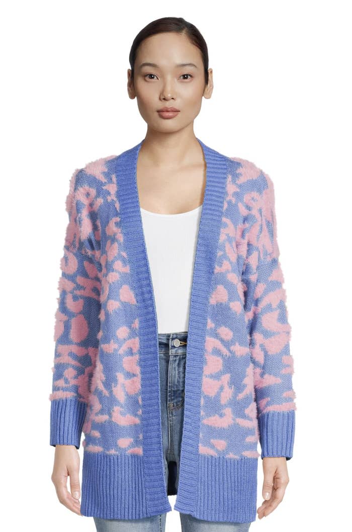 Model wearing blue and pink cheetah cardigan