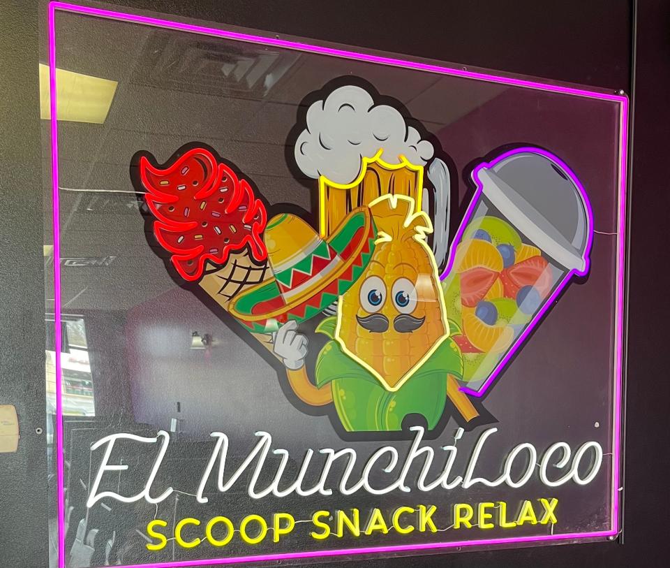 The El MunchiLoco signs brightens the interior of the new sweets and snacks restaurant at Edison and Hickory roads in South Bend.