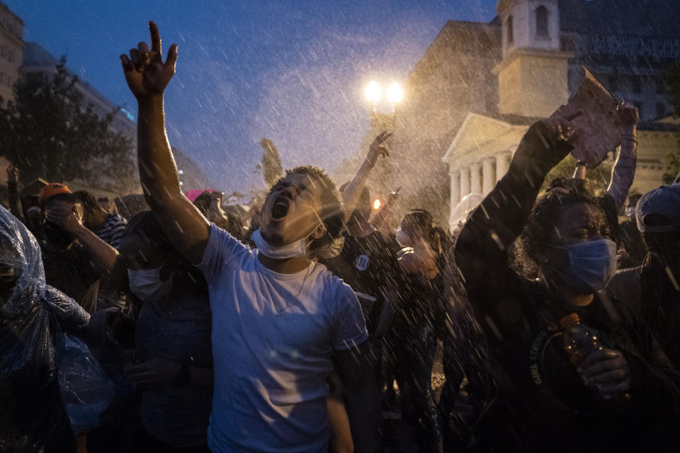 Demonstrators protest, June 4, 2020, near the White House in Washington, D.C., over the death of George Floyd. The image was part of a series of photographs by The Associated Press that won the 2021 Pulitzer Prize for breaking news photography. (AP Photo/Evan Vucci)