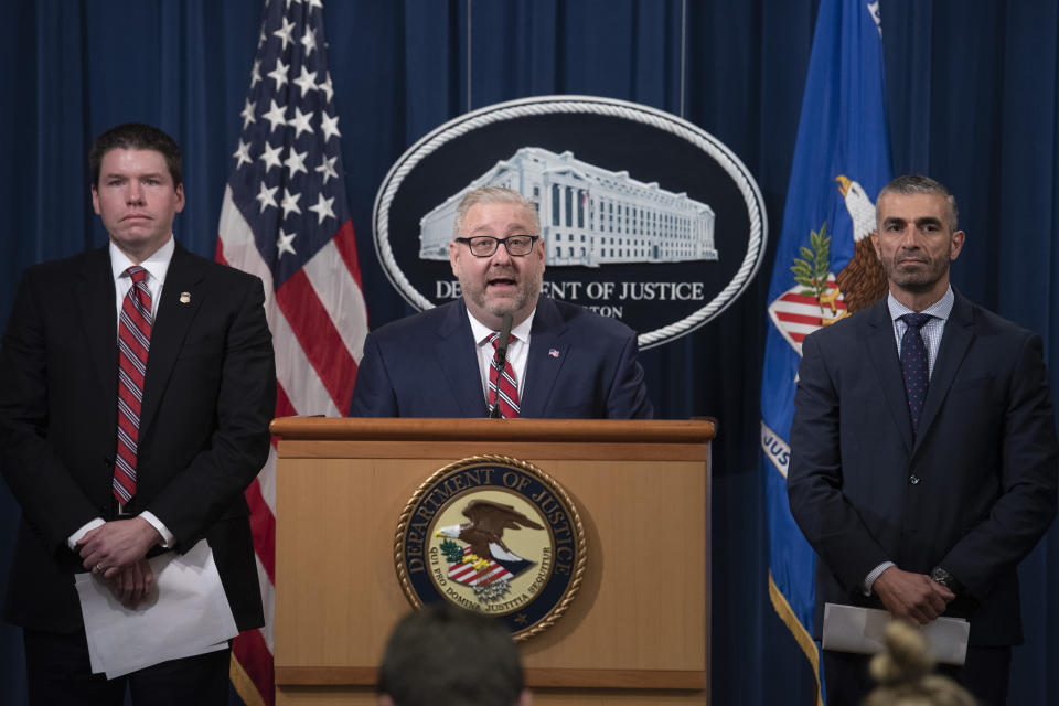 Assistant Attorney General Brian Benczkowski, center, in charge of the criminal division at the Dept. of Justice, U.S. Attorney Robert Duncan, of the Eastern District of Kentucky, left, and FBI Special Agent George Piro, right, in charge of the FBI’s Miami office, appears at a news conference to announce charges against ten former National Football League (NFL) players who are accused of defrauding an NFL health care program, at the Justice Department in Washington, Thursday, Dec. 12, 2019. (AP Photo/Cliff Owen)