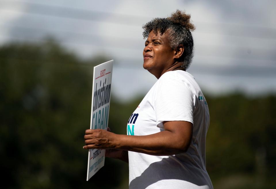 Activists greet voters at the Souls to the Polls event on Sunday, Nov. 6, 2022 at the Dr. B. L. Perry, Jr. Branch Library in Tallahassee, Fla. 