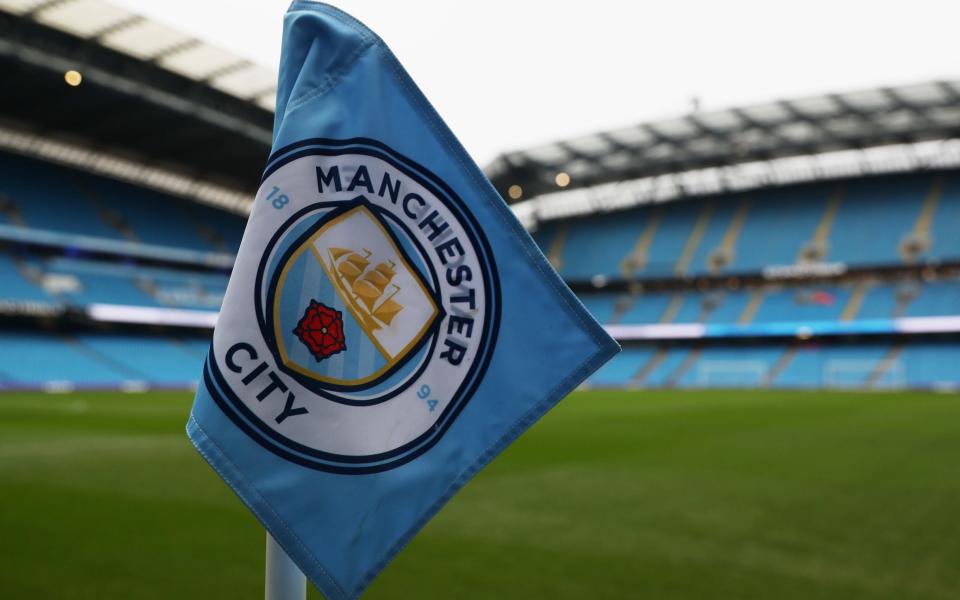 Manchester City corner flag at an empty Etihad Stadium - Manchester City charged by Premier League with multiple breaches of FFP rules - Getty Images/Matthew Lewis