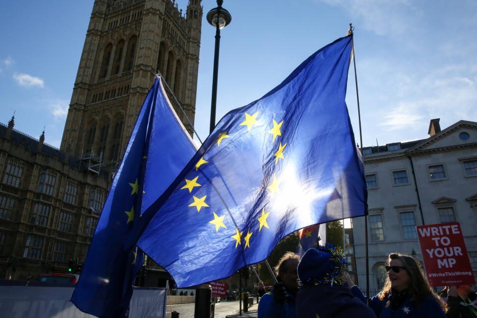 Anti-Brexit demonstrators wave European Union flags outside the Houses of Parliament. Photo by Dinendra Haria/SOPA Images/LightRocket for Getty Images